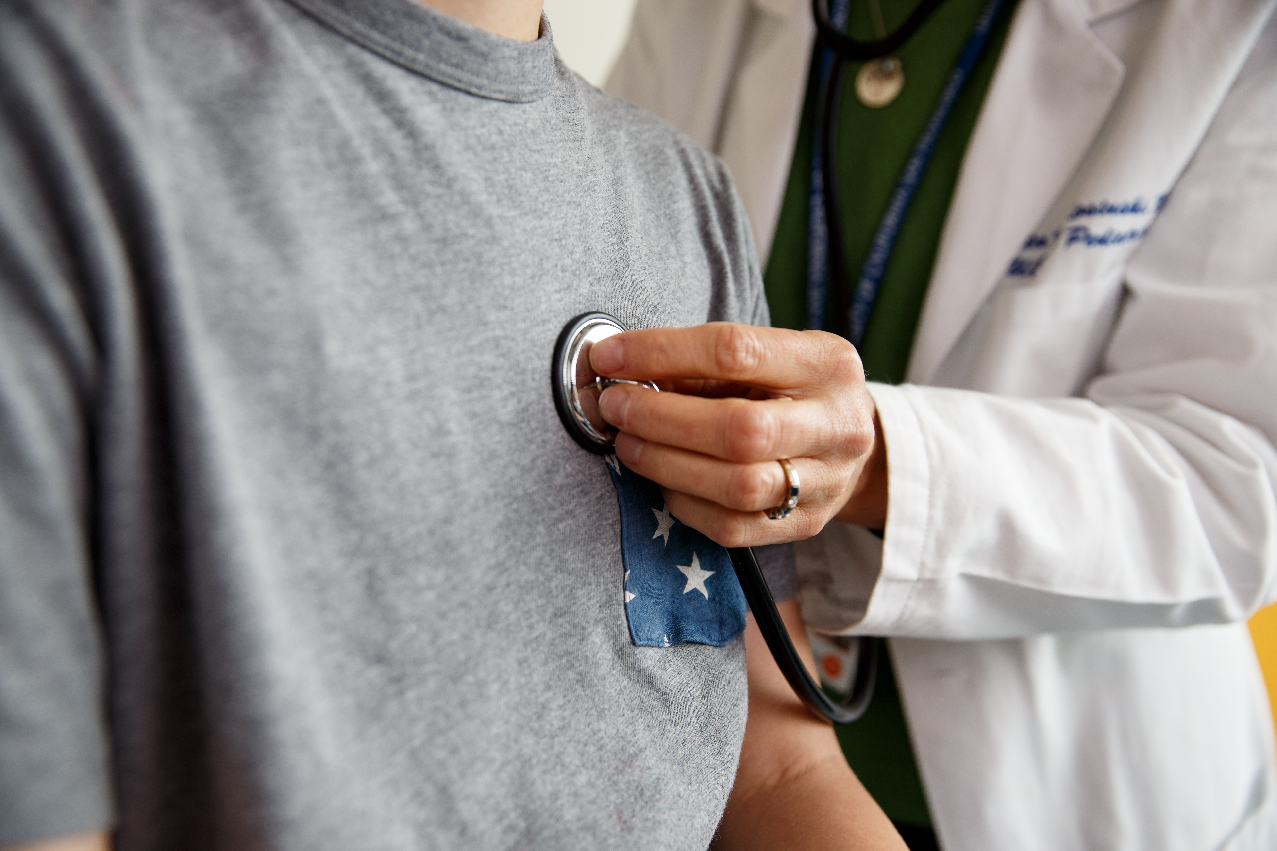 Doctor applying a stethoscope to a patient's chest